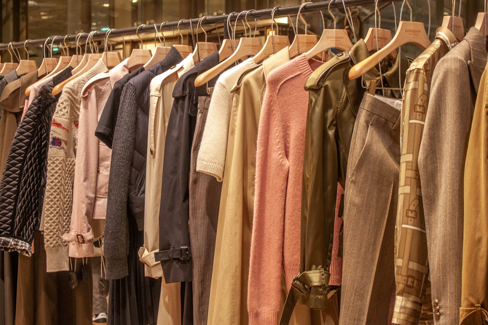 Outerwear and tailored garments hanging together