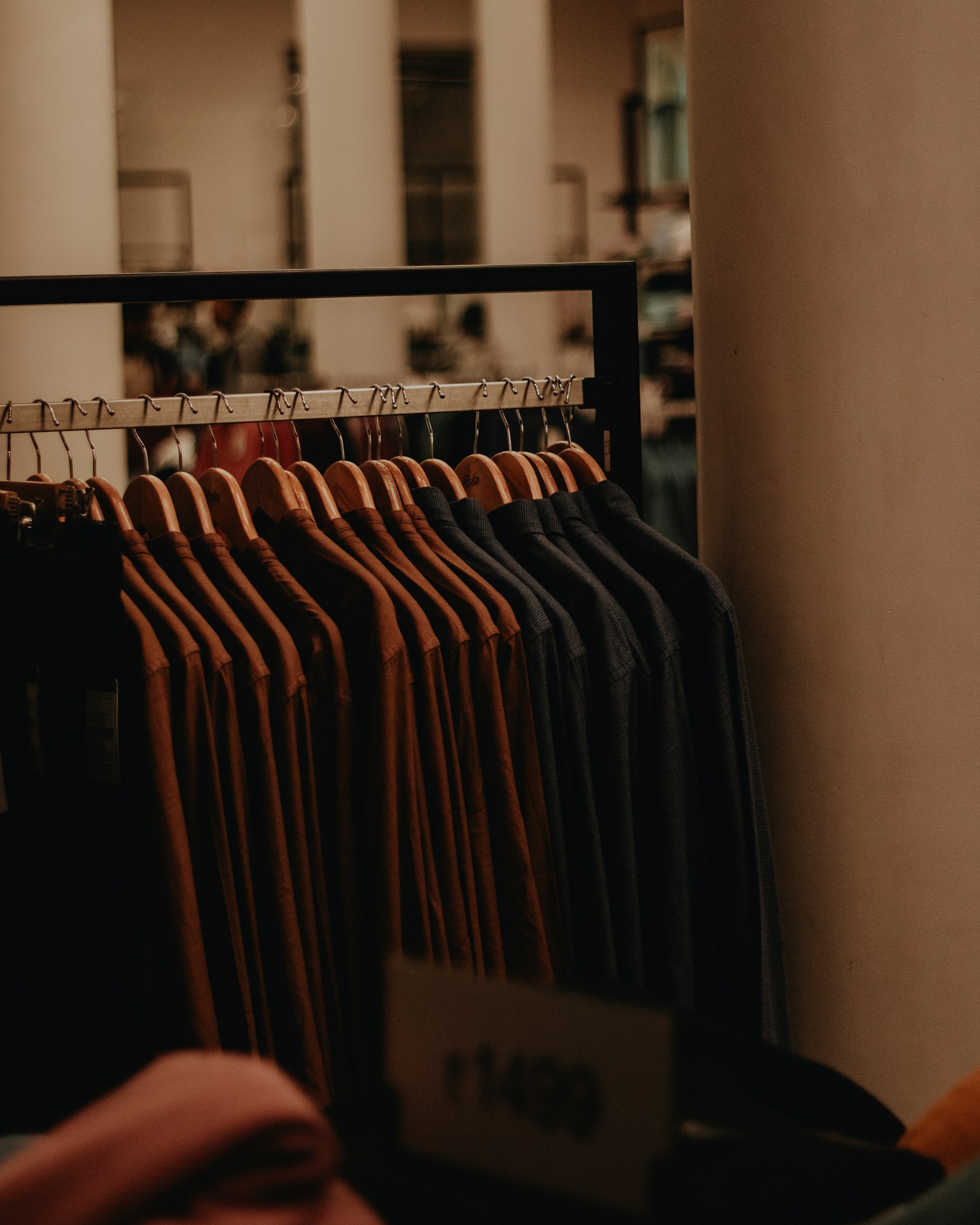 Neutral shirts displayed on hangers