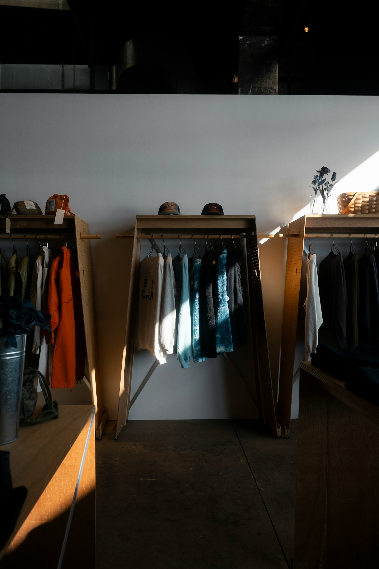 Well-lit fashion retail store with apparel racks